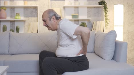 The-old-man's-back-hurts.-Lumbar-hernia-and-joint-pain.